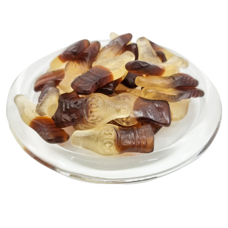 Cola bottle lollies on a clear plate